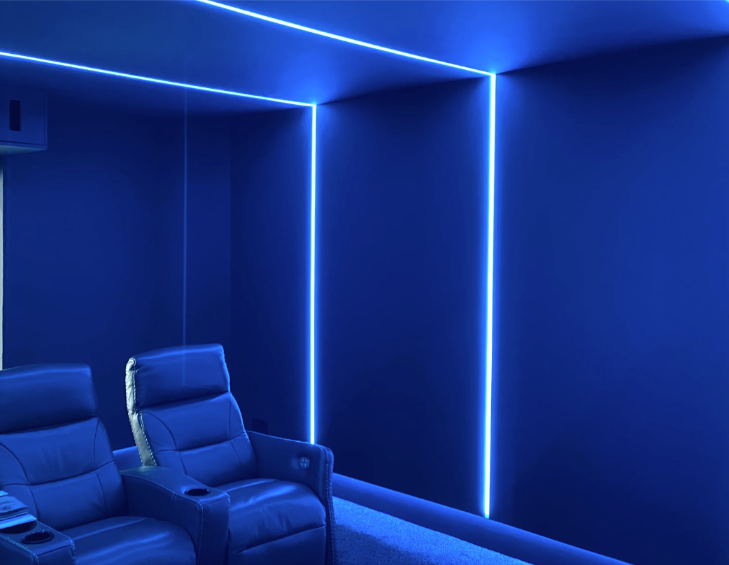 Cinema room with blue atmospheric lighting