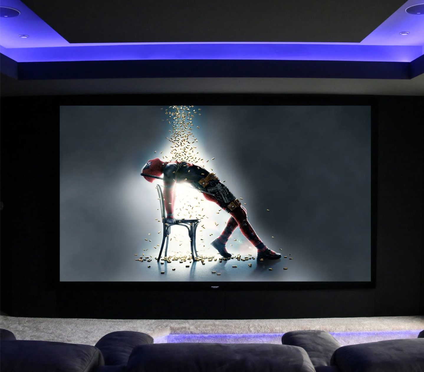 Large cinema screen with dancer using chair. Purple mood lighting in ceiling